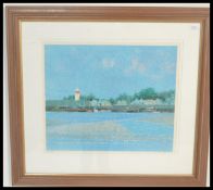 A 20th Century print on paper of a port with moored sailing boats,a lighthouse and  buildings,