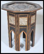 A 19th century Moorish mother of pearl inlaid hardwood octagonal occasional table raised on a shaped