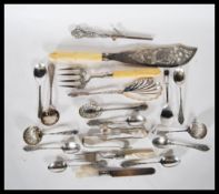 A collection of silver plated flatware to include a J Sherwood & Sons fish serving set having