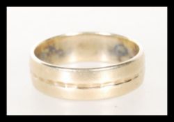 A mid 20th Century hallmarked 9ct gold band ring, having engraving to inner. Hallmarked for London