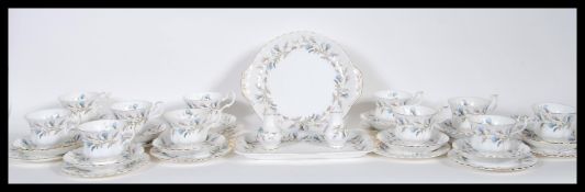 A Royal Albert tea service in the Brigadoon pattern, consisting of eleven cups, saucers and side