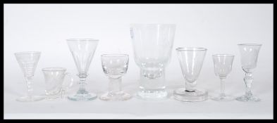 A collection of 18th and 19th century Georgian drinking glasses to include a trumpet bowl example on