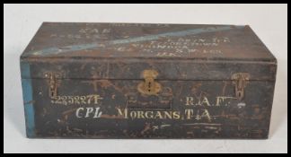 An early 20th Century ebonised tin military steamer trunk, hinged lid with lock and clasps to the
