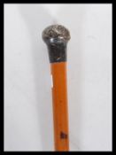 An early 20th Century Edwardian Malacca walking opera stick having a silver knop handle to the