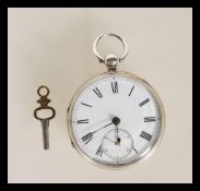 A Victorian silver hallmarked open faced pocket watch hallmarked for Birmingham 1884. Makers name to