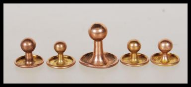 A selection of hallmarked 9ct gold collar studs to include one large and four smaller examples.