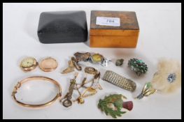 A collection of vintage jewellery to include a hallmarked 9ct gold bangle bracelet having engraved