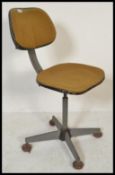 A vintage retro 20th Century industrial swivel chair, upholstered seat pad and backrest raised on