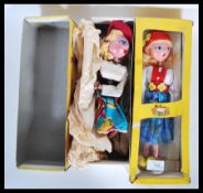 Two vintage toy Pelham puppets to include Tyrolean Girl and Mitzi, both in their original boxes.