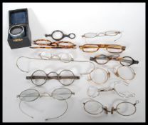 A small group of 20th Century folding spectacles glasses / Lorgnettes / opera glasses, most having