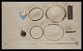 A collection of silver jewellery to include a silver hallmarked bangle bracelet having a engraved