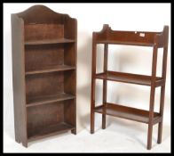 An early 20th Century Art Nouveau inspired open front oak waterfall bookcase with fitted shelves