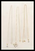 A group of three 9ct gold necklaces to include a stamped 9k necklace chain with a square cut CZ