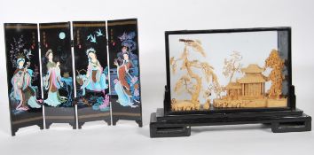 A early 20th Century Japanese carved cork landscape diorama with pagodas, trees and stalks, in an