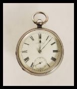 A silver hallmarked Victorian open faced pocket watch with roman numeral chapter ring and sub