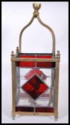 A 19th Century Victorian porch lantern having four leaded red and clear glass panels set within a