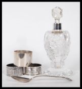 A collection of silver hallmarked items to include a silver collared perfume bottle, a silver