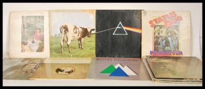 A collection of vinyl long play LP record albums to include Pink Floyd Dark side of the moon and