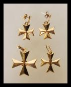 A selection of gold jewellery to include two stamped 750 18ct gold cross pendants along with a