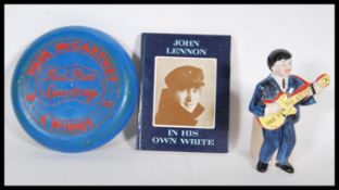 Beatles memorabilia to include John Lennon In his own write book and a Beatles single figure money