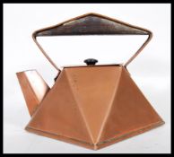 A early 20th Century Art Deco copper kettle in the style of Christopher Dresser, being hexagonal