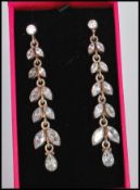 A pair of 20th Century silver foliate drop earrings set with CZ's. Stamped 925 to verso.