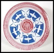 Aldermaston interest - Laurence McGowan (born 1942) a stoneware studio pottery charger painted in