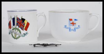 A silver RAF pin badge in the form of RAF wings stamped sterling silver to verso, together with