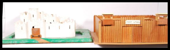 Two vintage 20th Century children's play forts, constructed from wood with painted details