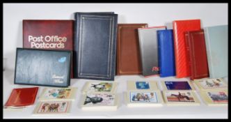 GB Stamp Postcards from 1974. Large quantity in nine albums plus many loose all in box. Most