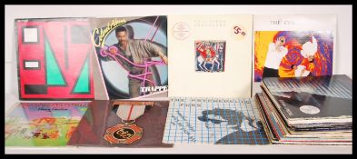 A collection of vinyl long play LP record albums to include Split Enz, Colonel Abrams, ELO,