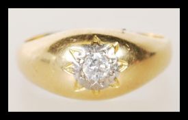 A hallmarked 18ct gold ring gypsy set with a brilliant cut diamond to the head. Hallmarked 1969.