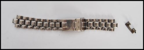 A 20th Century gents stainless steel watch strap for Breitling, stamped Breitling 1884. Measures
