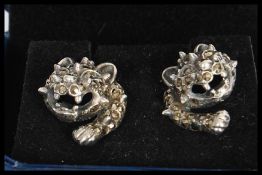 A pair of silver and marcasite designer earrings in the form of panthers. Stamped 925 to verso.
