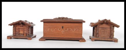 A 20th Century carved black forest lidded box having carved floral sprays to the top along with