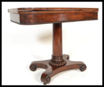 A 19th Century Mahogany tea / card table raised on