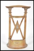 An early 20th Century cast iron miniature stickstand stick stand possible salesman or apprentice