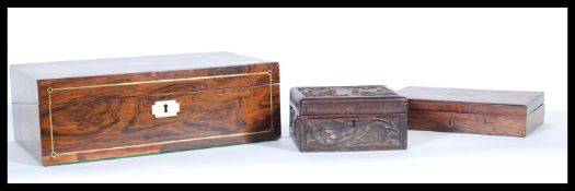 A selection of wooden boxes to include a 19th Century writing slope box having inlaid borders with a