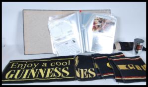 Guinness Breweriana. Box with album of vintage and more modern advertising postcards, beer mats, bar