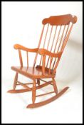 A Victorian antique style rocking chair / windsor armchair. Sleigh runners with turned legs united