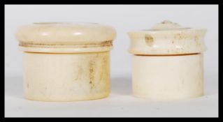 Two 19th Century georgian graduating turned bone snuff / pill boxes having threaded tops / lids.