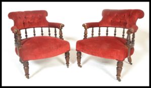 A matching pair of 19th Century late Victorian mahogany framed tub armchairs  having red fabric seat
