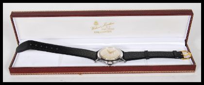 A vintage 20th Century Tissot Automatic gents wrist watch, silvered dial with gold coloured hands