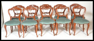 A set of 10 Victorian style balloon back  mahogany dining chairs. Raised on slender shaped legs with