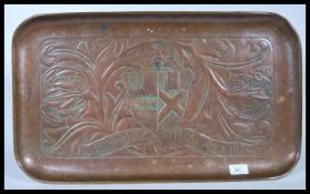 A late 19th Century Victorian Arts and Crafts hand worked copper tray in the Newlyn style, worked in