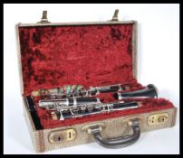 An Ebony `Student Console` Clarinet by Selmer, London, serial number 1344, in original faux