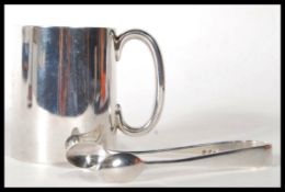 A silver hallmarked Atkin Brothers tankard of tapering cylindrical form retailed by Sorley in