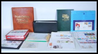 A collection of British stamps mostly first day covers to include, an album of post office first day