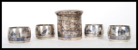 A selection of 20th Century silver white metal Persian Islamic napkin rings having niello decoration