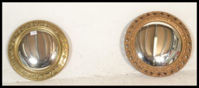 Two vintage 20th Century wall mirrors of round porthole form having  gilt frames, one having